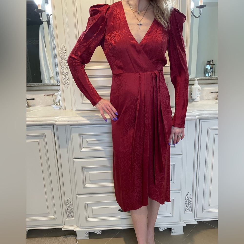 Red wrap dress with detailed shoulders with subtle detail